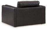 Ashley Furniture Amiata oversized chair with plush upholstery and wide armrests, shown in a stylish living room setting.