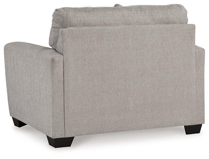 Oversized chair from Ashley Furniture with plush cushions and neutral fabric, perfect for a modern living room.