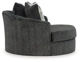 Ashley Furniture Biddeford oversized swivel accent chair with plush fabric and wide armrests, shown in a cozy, modern living room setting.