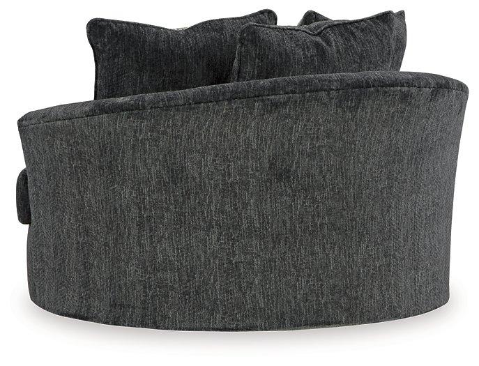 Ashley Furniture Biddeford oversized swivel accent chair with plush fabric and modern design, shown in a cozy living room setting.