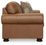 Ashley Furniture Carianna oversized chair with plush upholstery and wide armrests, shown from a side angle.