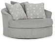 Ashley Casselbury oversized swivel accent chair with plush upholstery and contemporary design, shown in a modern living room setting.