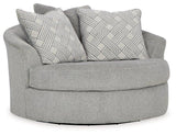 Ashley Casselbury oversized swivel accent chair with plush upholstery and contemporary design, shown in a modern living room setting.