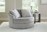 Oversized Ashley Furniture Casselbury swivel accent chair with plush fabric and rounded armrests, perfect for stylish living spaces.