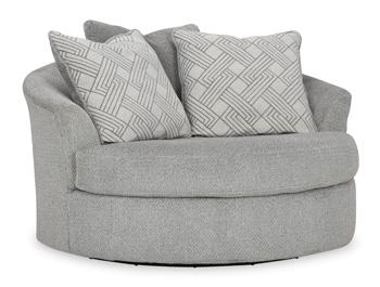 Ashley Furniture Casselbury oversized swivel accent chair with plush fabric and modern design, shown in a stylish living room setting.