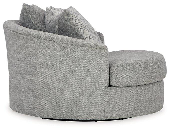 Oversized Ashley Furniture Casselbury swivel accent chair with plush upholstery and modern design, shown in a cozy living room setting.