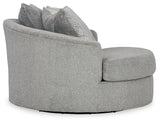Oversized Ashley Furniture Casselbury swivel accent chair with plush upholstery and modern design, shown in a cozy living room setting.