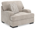 Ashley Furniture high profile oversized chair with plush upholstery and wide armrests, viewed from an angled perspective.