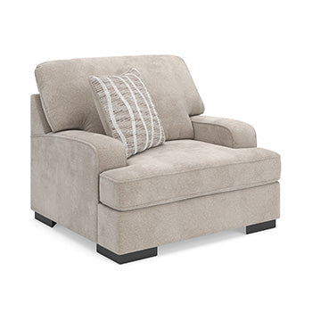 Ashley Furniture high profile oversized chair with plush upholstery and wide armrests, viewed from an angle.