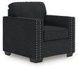 Ashley Furniture Jasmine Peaks Chair with upholstered seat and wooden legs, shown from an angled side view.