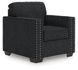Ashley Furniture Jasmine Peaks Chair with upholstered seat and wooden legs, shown from an angled side view.