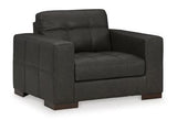 Ashley Furniture Luigi oversized chair with plush upholstery and a modern design, shown in a cozy living room setting.