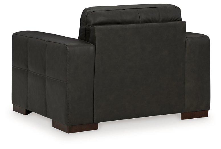 Ashley Furniture Luigi oversized chair featuring plush upholstery, wide seat, and stylish design perfect for modern living rooms.