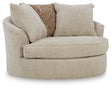 Ashley Furniture Steelwater Retreat oversized swivel accent chair with plush upholstery and rounded armrests, shown from an angled view.