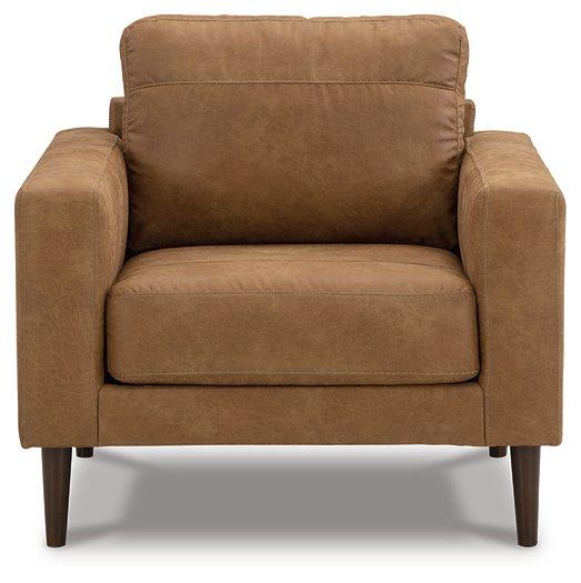 Ashley Furniture Telora Chair with plush upholstered seat and back, featuring sleek wooden legs and modern design.