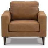 Ashley Furniture Telora Chair with plush upholstered seat and back, featuring sleek wooden legs and modern design.