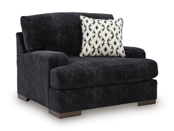 Ashley Furniture Whitmore Manor oversized chair with plush upholstery and wide armrests, shown from an angled view.