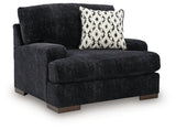 Ashley Furniture Whitmore Manor oversized chair with plush upholstery and wide armrests, shown from an angled side view.