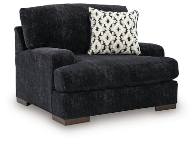 Ashley Furniture Whitmore Manor oversized chair with plush upholstery and wide armrests, shown from an angled side view.