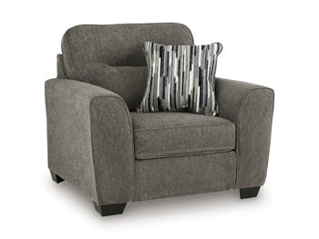 Ashley Furniture Olten oversized chair with plush fabric, wide armrests, and a comfortable cushioned seat, shown from an angled view.