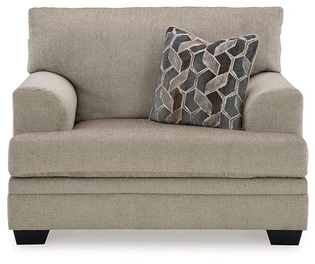 Oversized Ashley Furniture Stonemeade chair with plush cushions and soft fabric in a cozy living room setting.