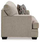 Oversized Ashley Furniture Stonemeade Chair with plush upholstery and wide, comfortable seating in a modern living room setting