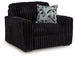 Ashley Furniture Midnight-Madness oversized chair with plush fabric and wide armrests, shown from an angled side view.