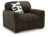 Oversized Midnight-Madness Ashley Furniture chair with plush fabric and wide seating, viewed from an angled perspective.