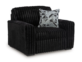 Ashley Furniture Midnight-Madness oversized chair with plush fabric and wide seating, shown from an angled view.