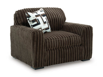 Ashley Furniture Midnight-Madness oversized chair with plush fabric and wide seating, shown from an angled view.