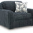 Ashley Furniture Midnight Madness oversized chair with plush fabric and wide armrests, shown from an angled side view.