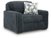 Ashley Furniture Midnight Madness oversized chair with plush fabric and wide armrests, shown from an angled side view.