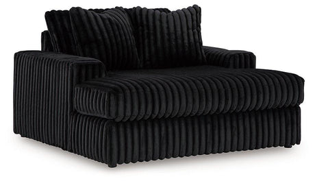 Oversized Midnight-Madness Ashley Furniture chair with plush upholstery and wide seating for a stylish, comfortable lounge.
