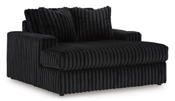 Oversized Midnight-Madness Ashley Furniture chair with plush cushions and modern design, perfect for a stylish living room.