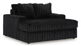 Oversized Midnight-Madness Ashley Furniture chair with plush cushions and modern design, perfect for a stylish living room.