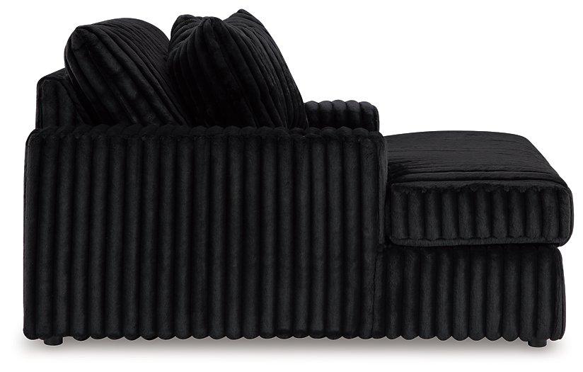 Ashley Furniture Midnight-Madness Oversized Chaise chair with plush upholstery and modern design, perfect for lounging in style.