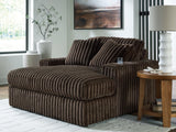 Ashley Furniture Midnight-Madness oversized chaise lounge chair with plush fabric and modern design, shown in a cozy living room setting.