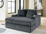 Ashley Furniture Midnight-Madness oversized chaise chair with plush fabric and contemporary design, shown in a cropped image.