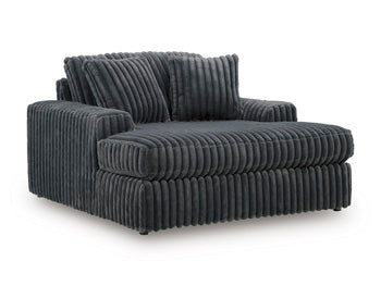 Ashley Furniture Midnight-Madness oversized chaise chair with plush fabric and wide seating, shown from an angled view.