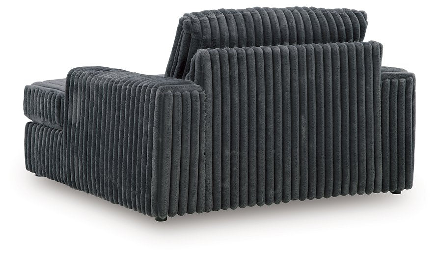 Ashley Furniture Midnight-Madness oversized chaise lounge with plush fabric and wide seating for relaxing comfort.