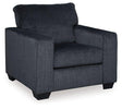 Ashley Furniture Altari Chair with plush fabric upholstery and wooden legs, showcasing a modern, comfortable seating design.