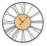Ashley Furniture Brockett wall clock with a modern round design and sleek black finish, perfect for contemporary home decor.