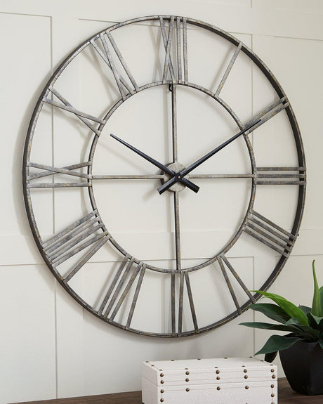 Ashley Furniture Paquita Wall Clock with a stylish round design and classic clock face, perfect for modern home decor.