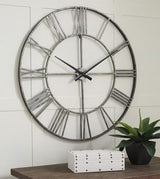 Ashley Furniture Paquita Wall Clock with a stylish round face and modern design, perfect for contemporary home decor.
