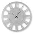 Ashley Furniture Reinport wall clock with a modern round design, black frame, and minimalist white clock face.