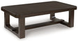 Ashley Furniture Breckington coffee table with a wooden top and metal legs, shown from an angled view.