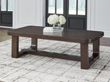 Ashley Furniture Breckington coffee table with a sleek wooden top and metal legs, designed as a stylish cocktail table.