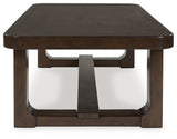 Ashley Furniture Breckington coffee table with a wooden finish, featuring a sleek rectangular design and modern accents.