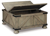 Open view of Ashley Furniture Aldwin coffee table with storage, featuring a modern cocktail table design with a dark wood finish.