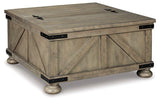Ashley Furniture Aldwin coffee table with storage, modern cocktail table featuring a sleek design and functional storage space.